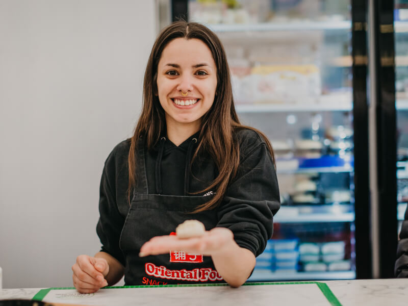 woman at cooking class with handmade dumpling